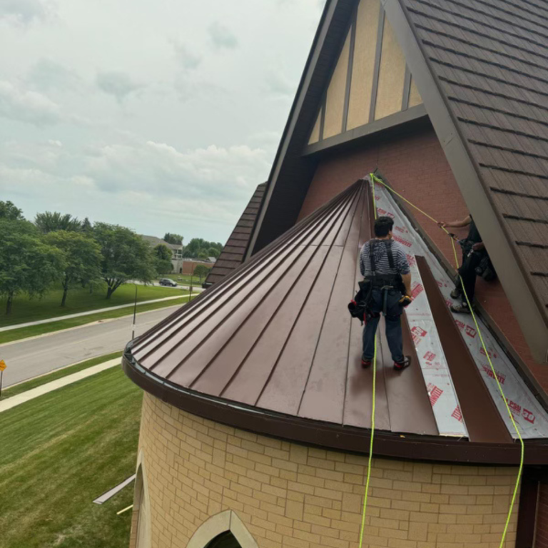 Endurance Exteriors using equipment to install roof underlayment