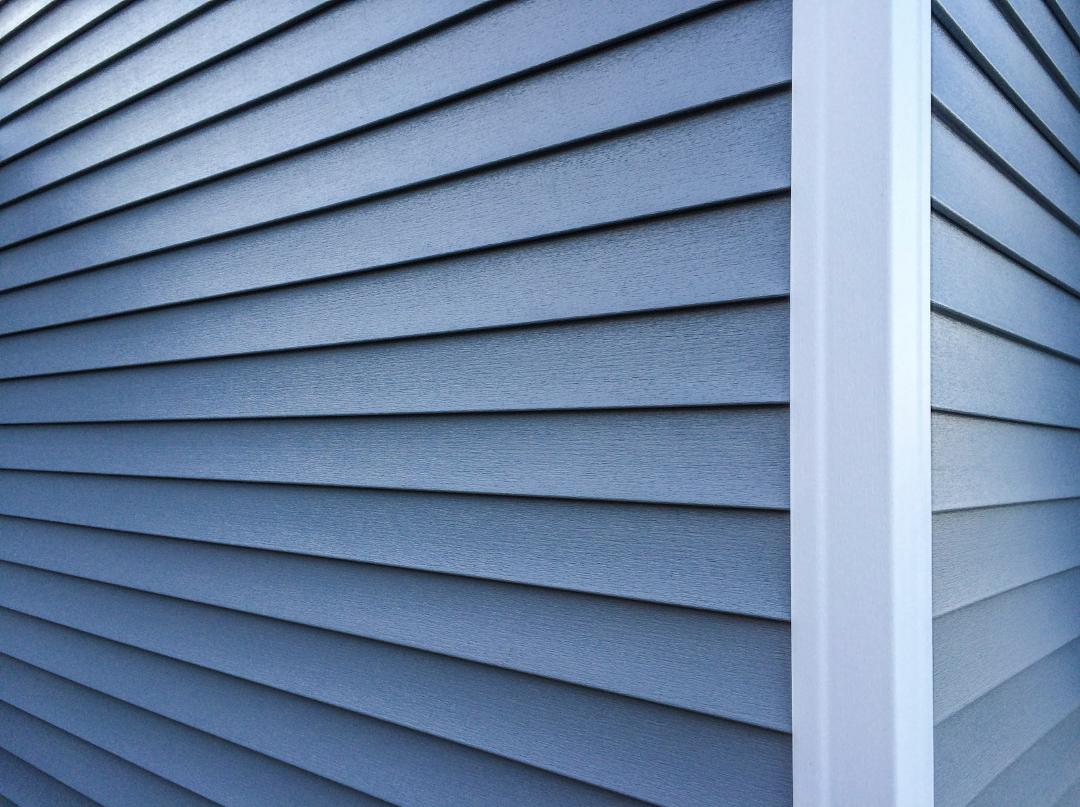 home with blue vinyl siding